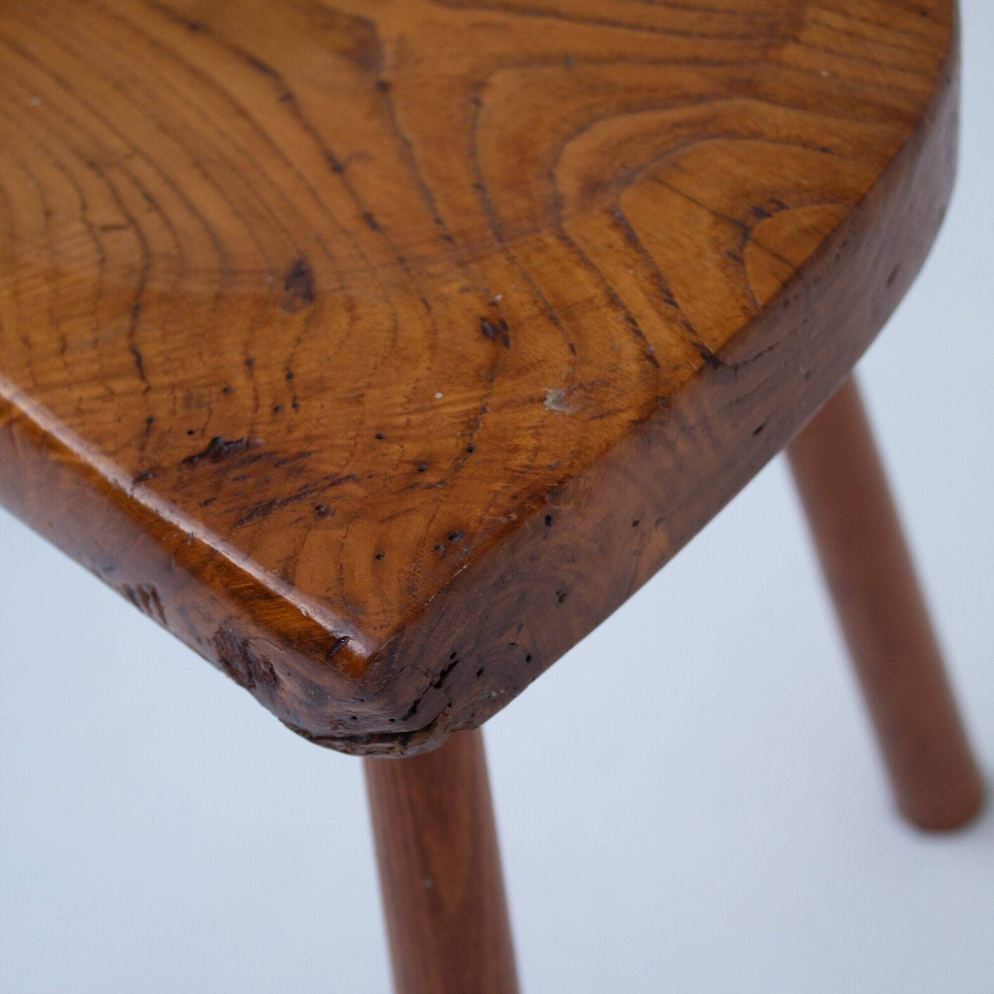 Set of two hand-carved wooden stools with sculpted seats