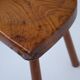 Set of two hand-carved wooden stools with sculpted seats