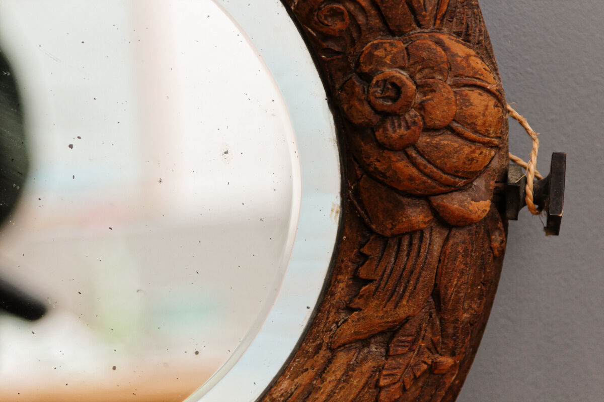 Beveled mirror in carved wood