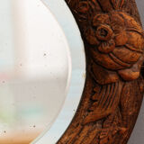 Beveled mirror in carved wood