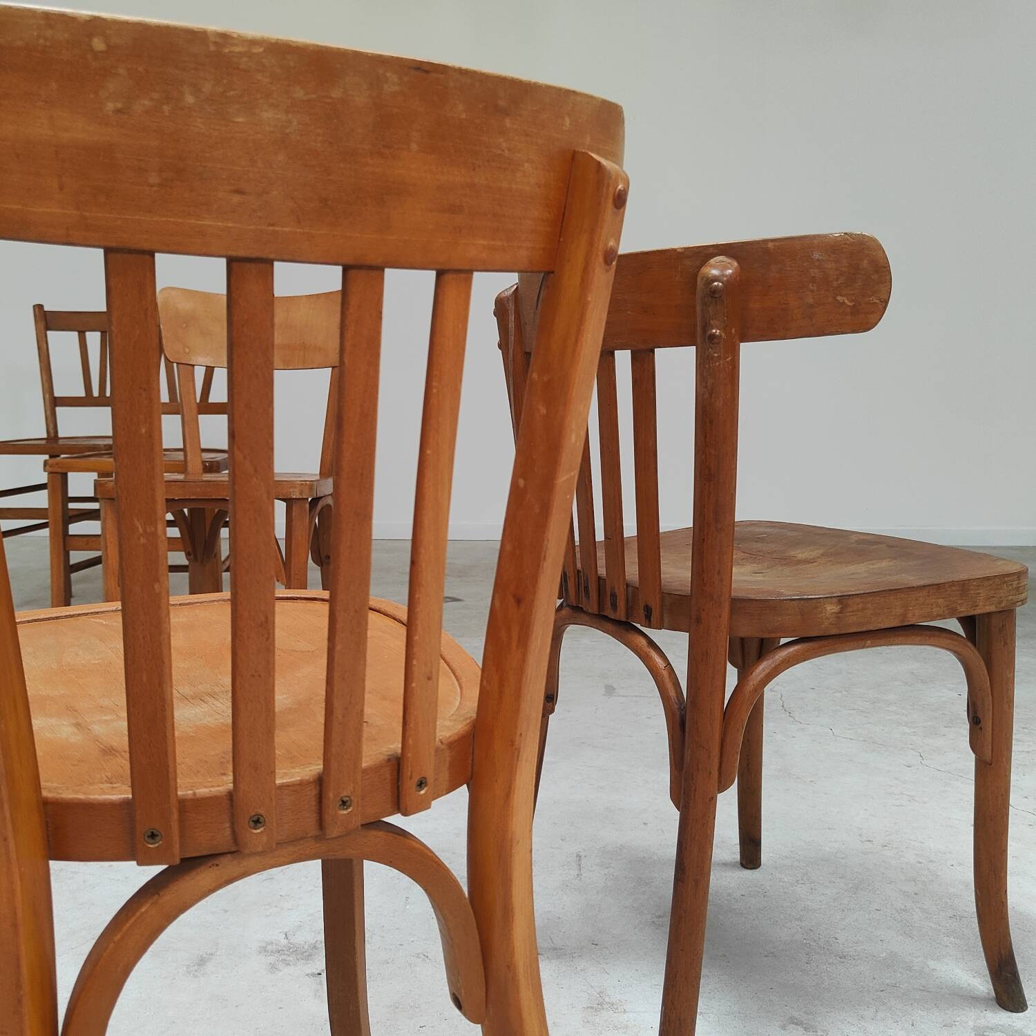 Set of 6 mismatched blond wood bistro chairs
