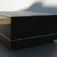 Designer coffee table in black lacquered wood and vintage brass