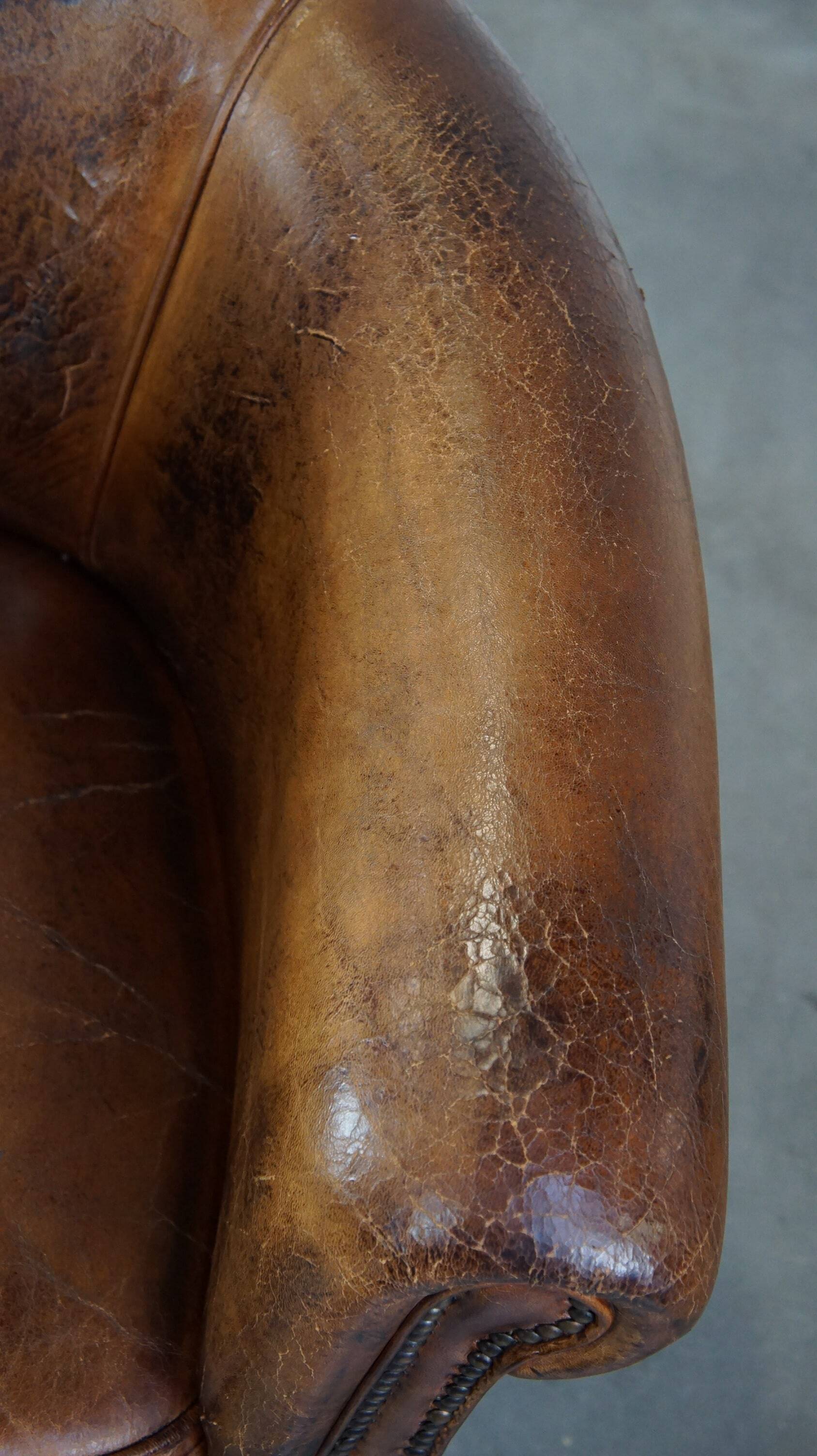 Sturdy, stately and subtle vintage sheepskin club chair