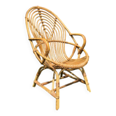 Fauteuil vintage en rotin de forme ovoïde.