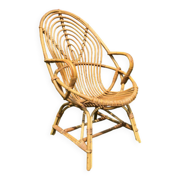 Vintage ovoid-shaped rattan armchair.