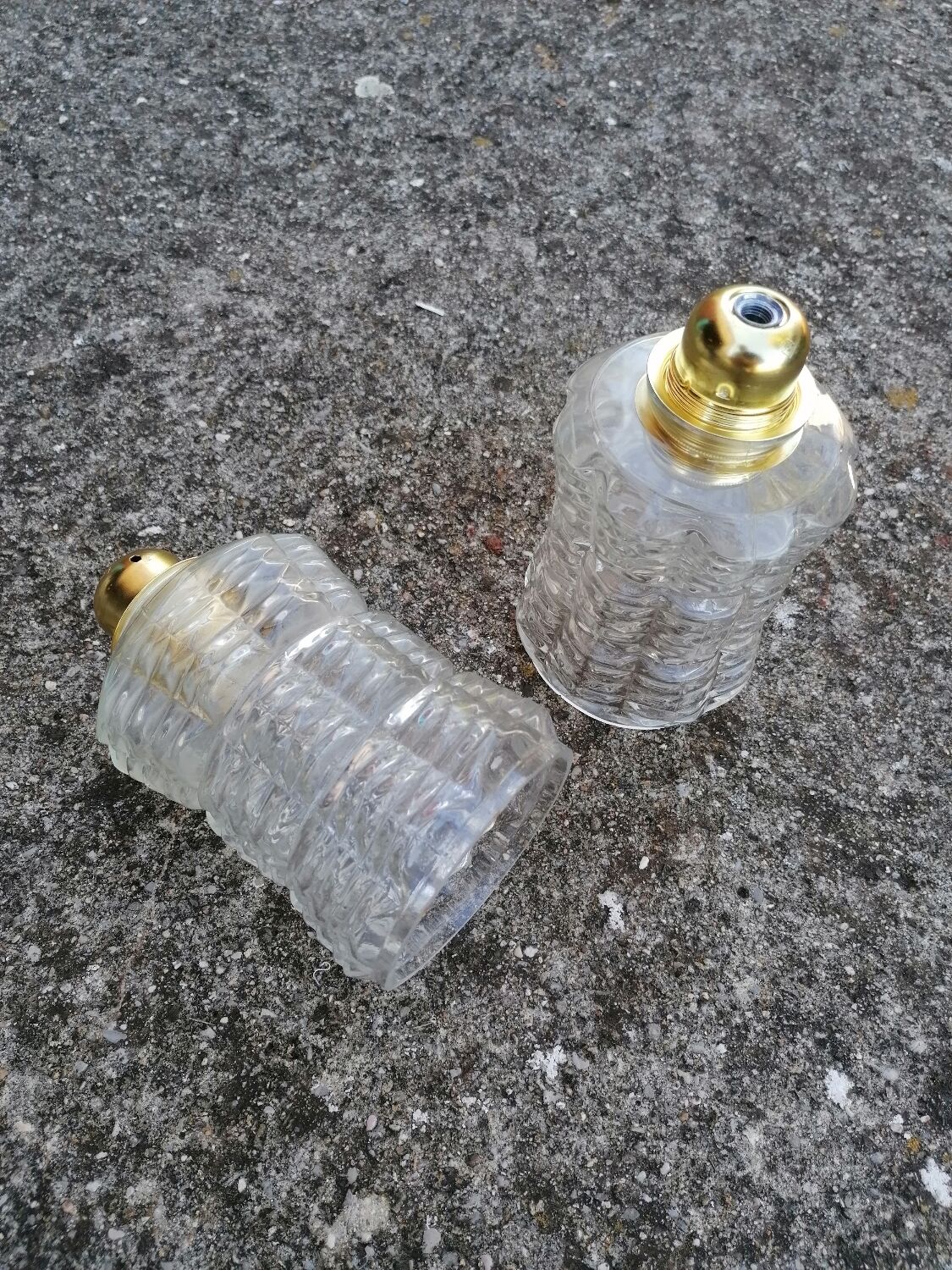 Duo of vintage molded glass globe pendant lights.