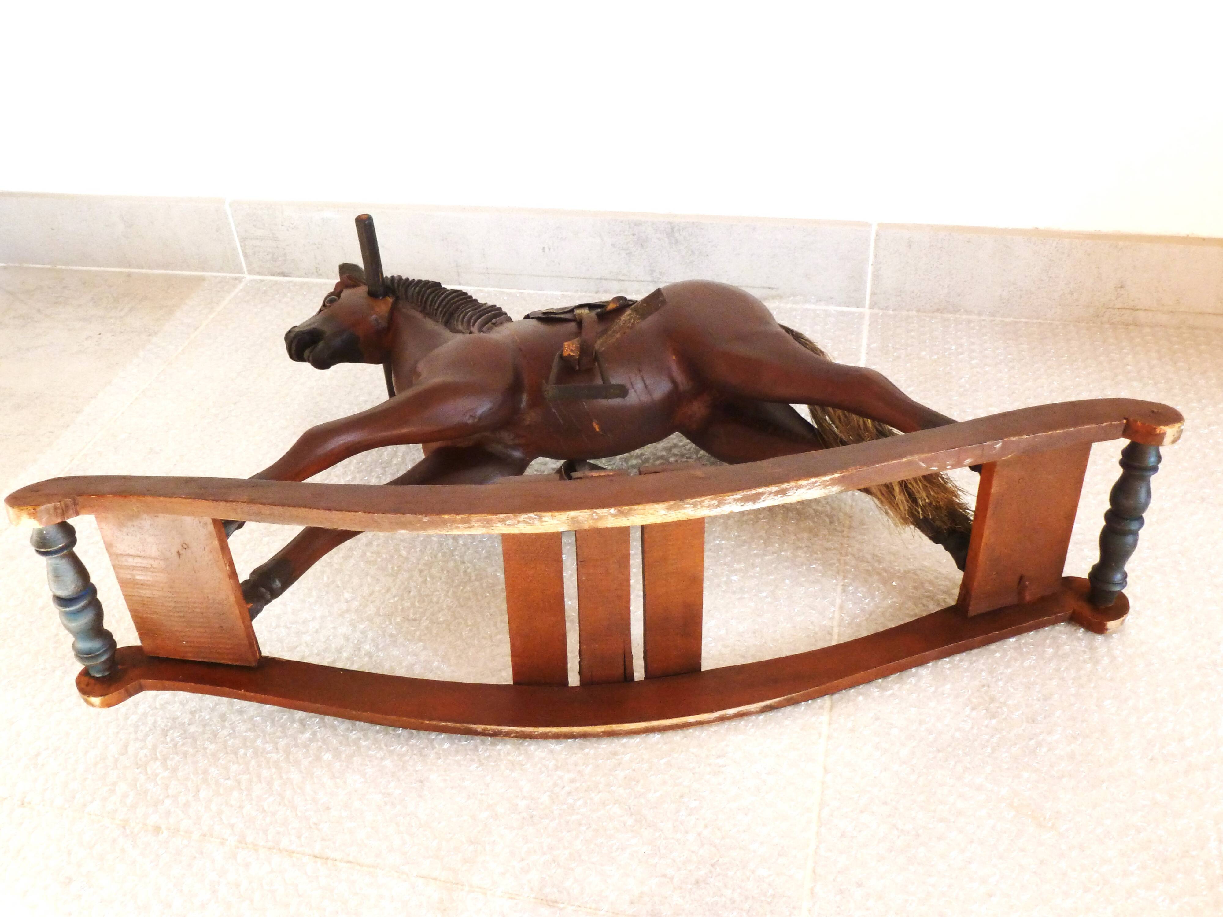 Antique wooden and leather rocking horse