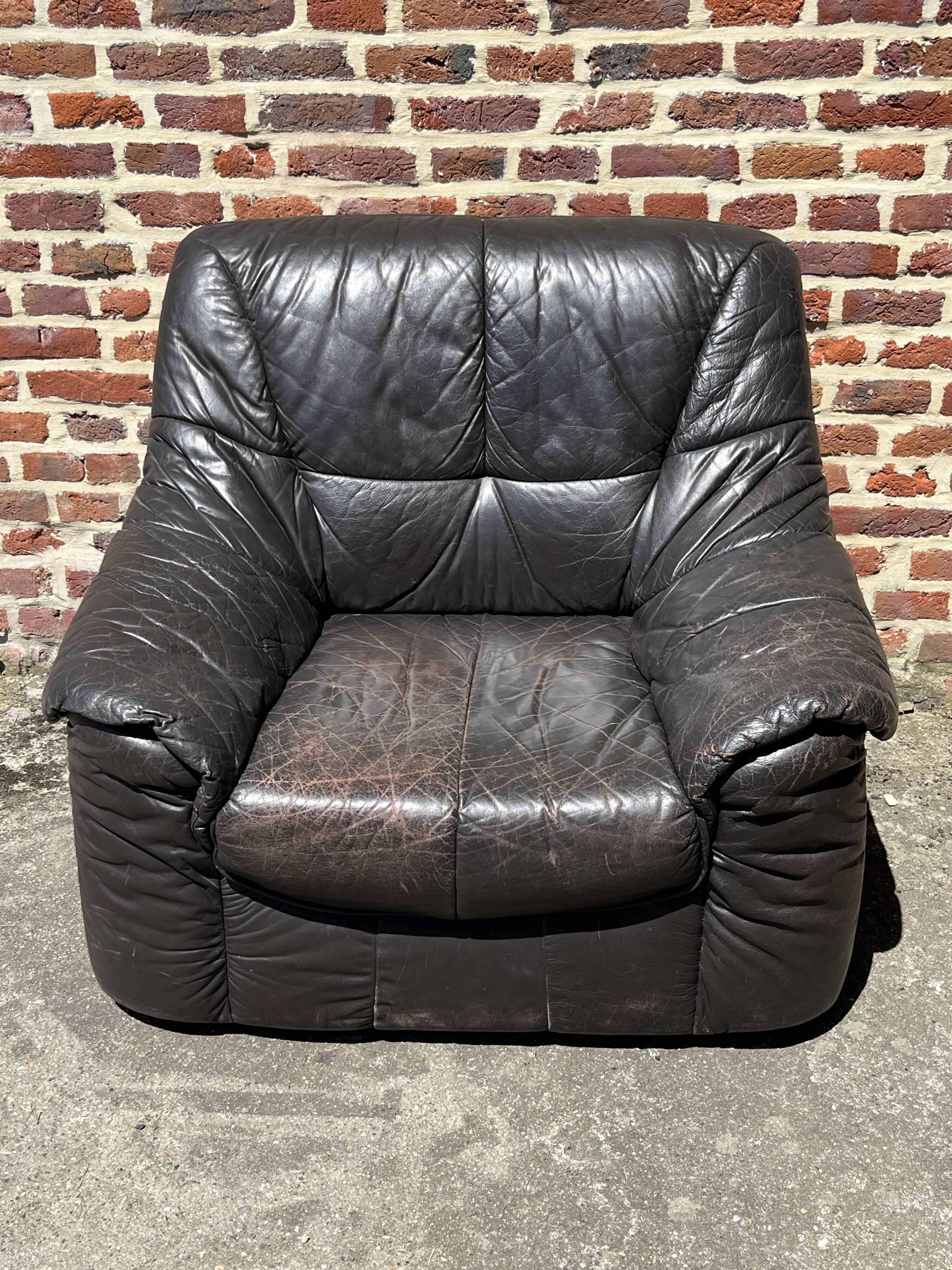 Pair of patinated leather club armchairs