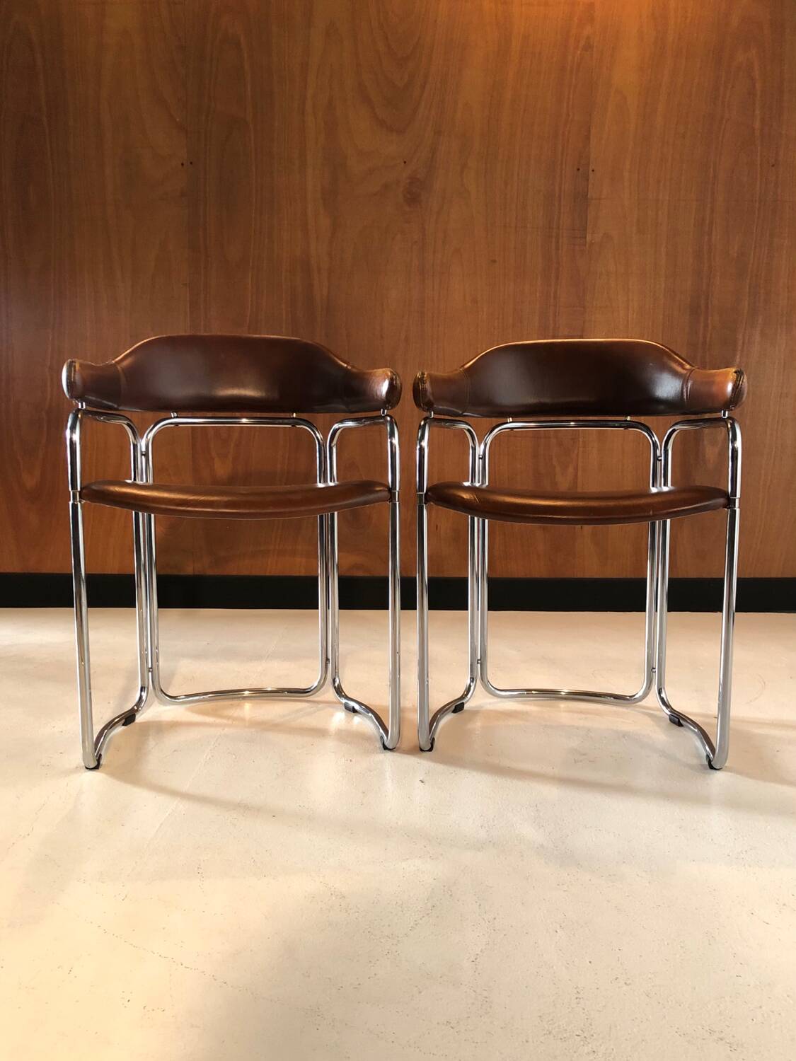 Pair of vintage armchairs, cognac leather and chrome steel 1970