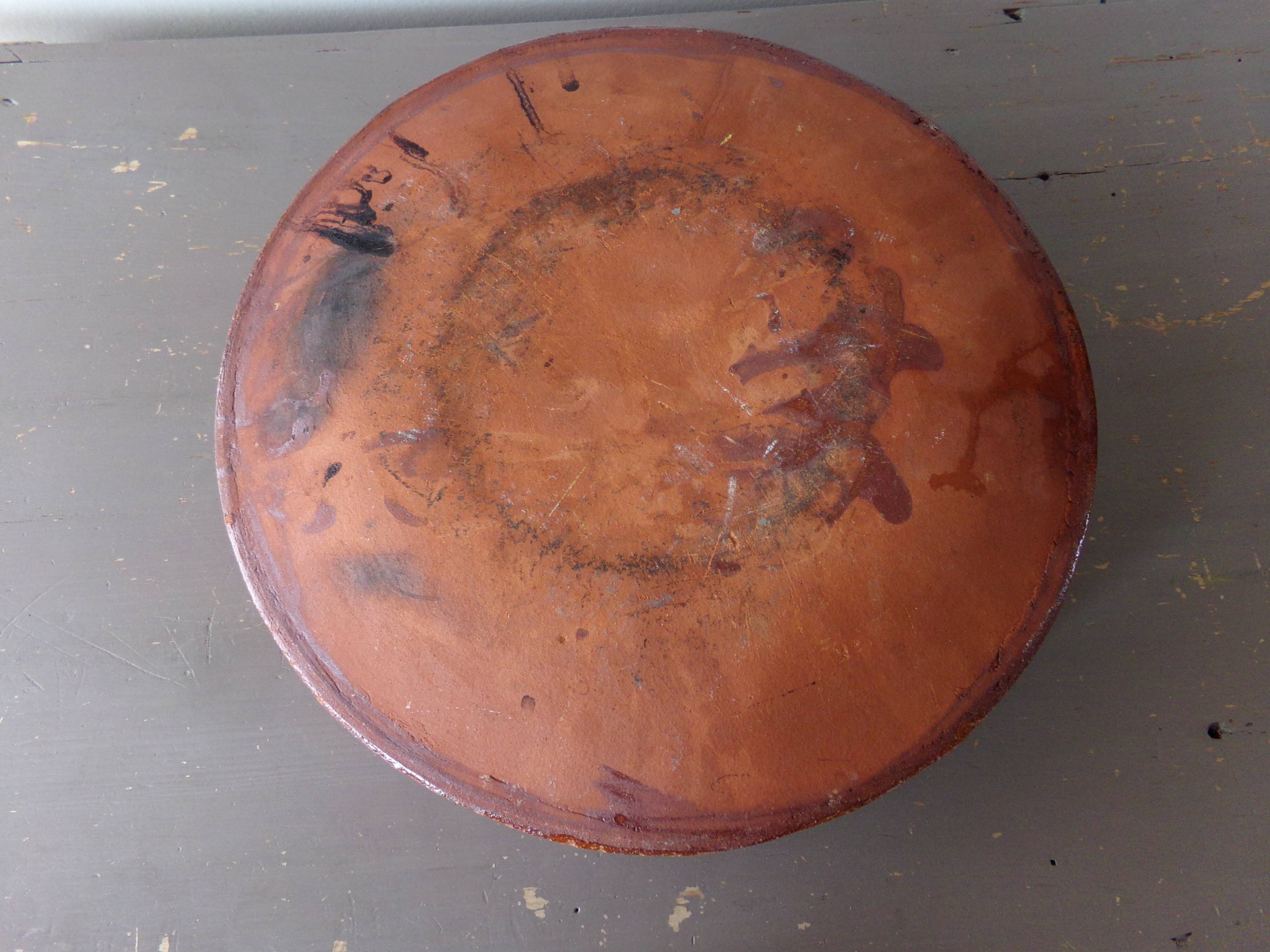 Antique dish in glazed terracotta