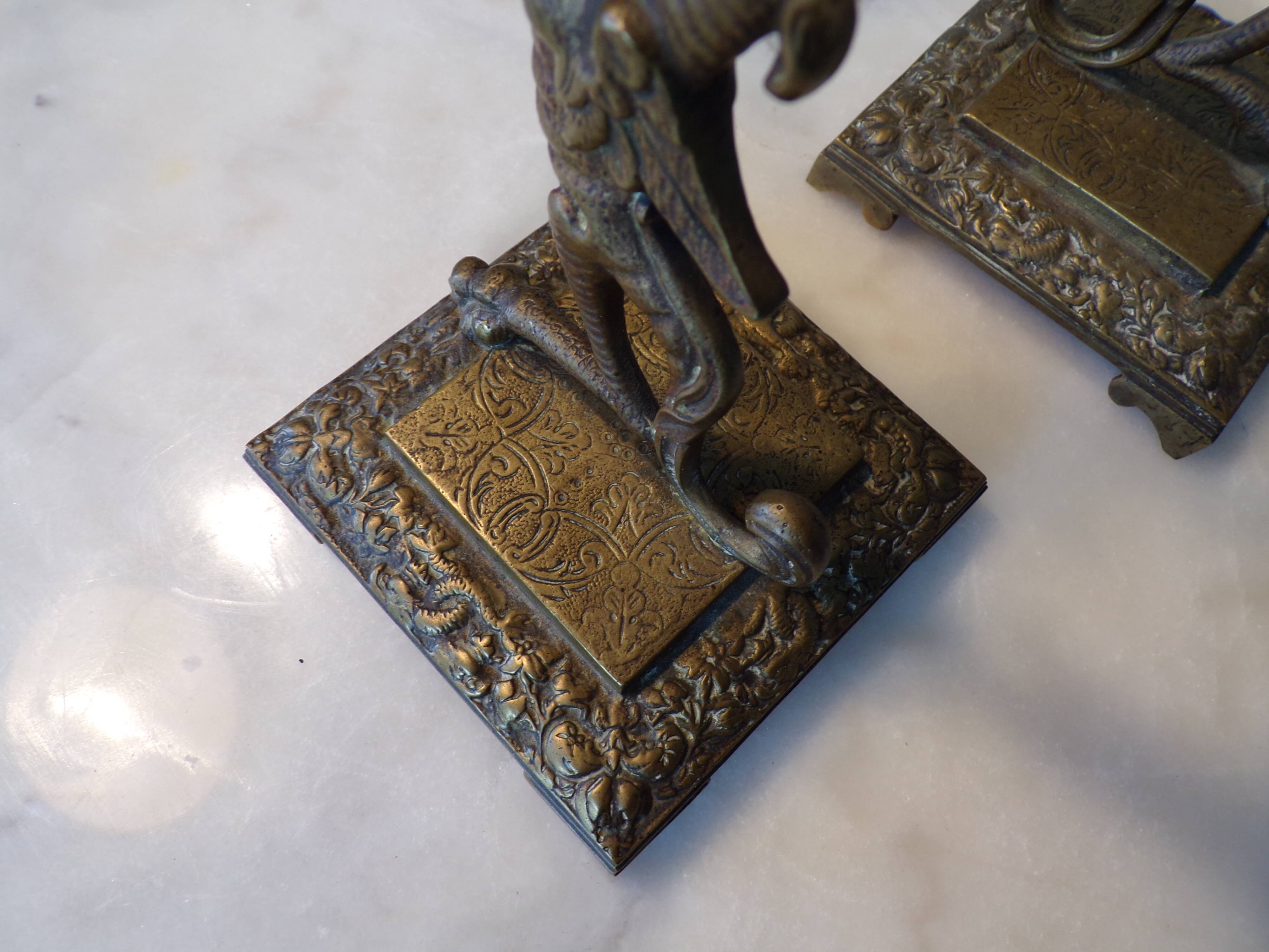 Pair of bronze chimera candlesticks