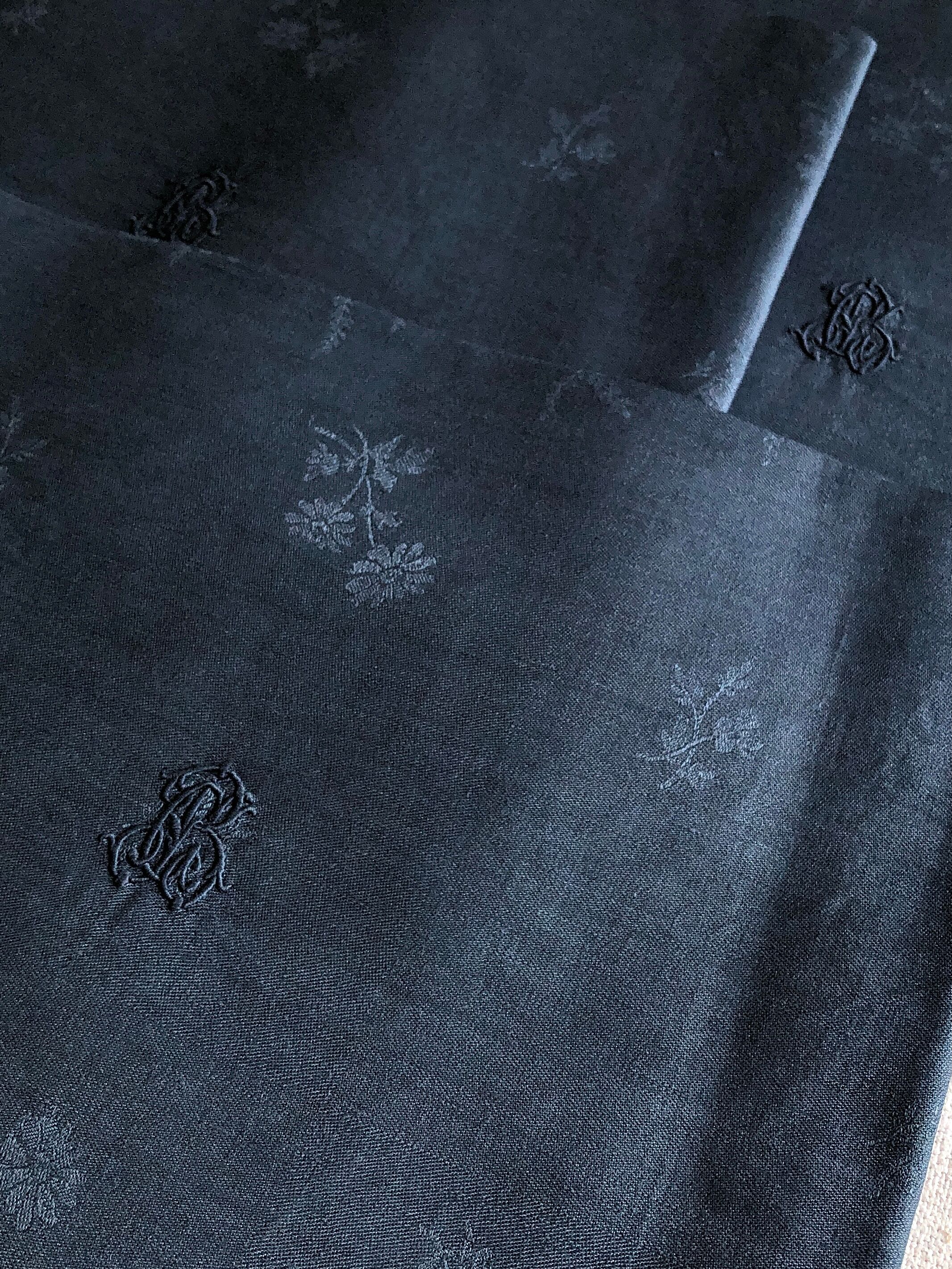 Lot four damasked and monogrammed towels linen and night blue silk