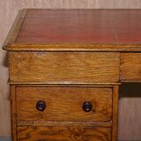 Rare oak partner's desk by Howard & Sons circa 1880 with leather.