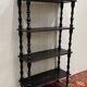 Blackened wooden shelf.