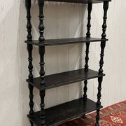 Blackened wooden shelf.