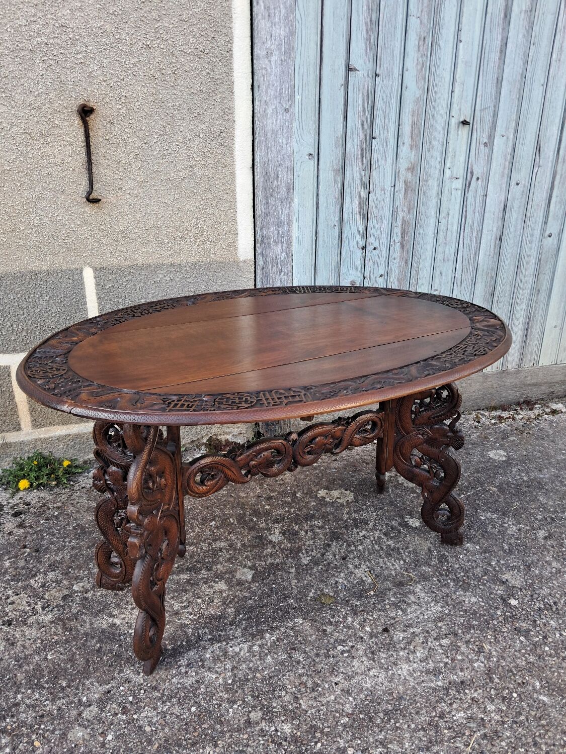 Asian table, mid-height, made of exotic wood.