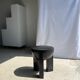 Black mango wood tripod side table with a semi-spherical top, height: 45 cm, diameter: 44 cm.