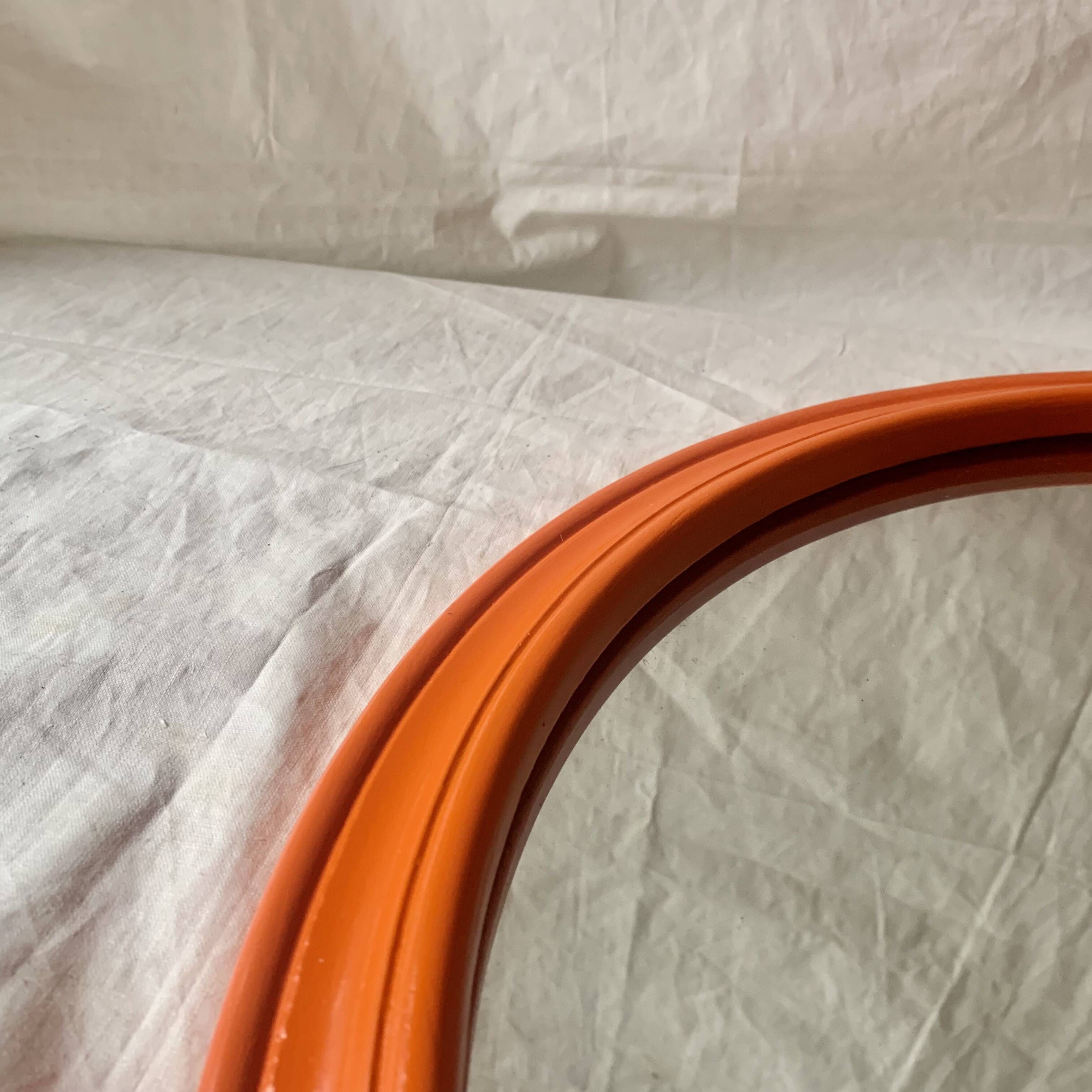 Vintage round wall mirror in orange painted wood - diameter: 48 cm