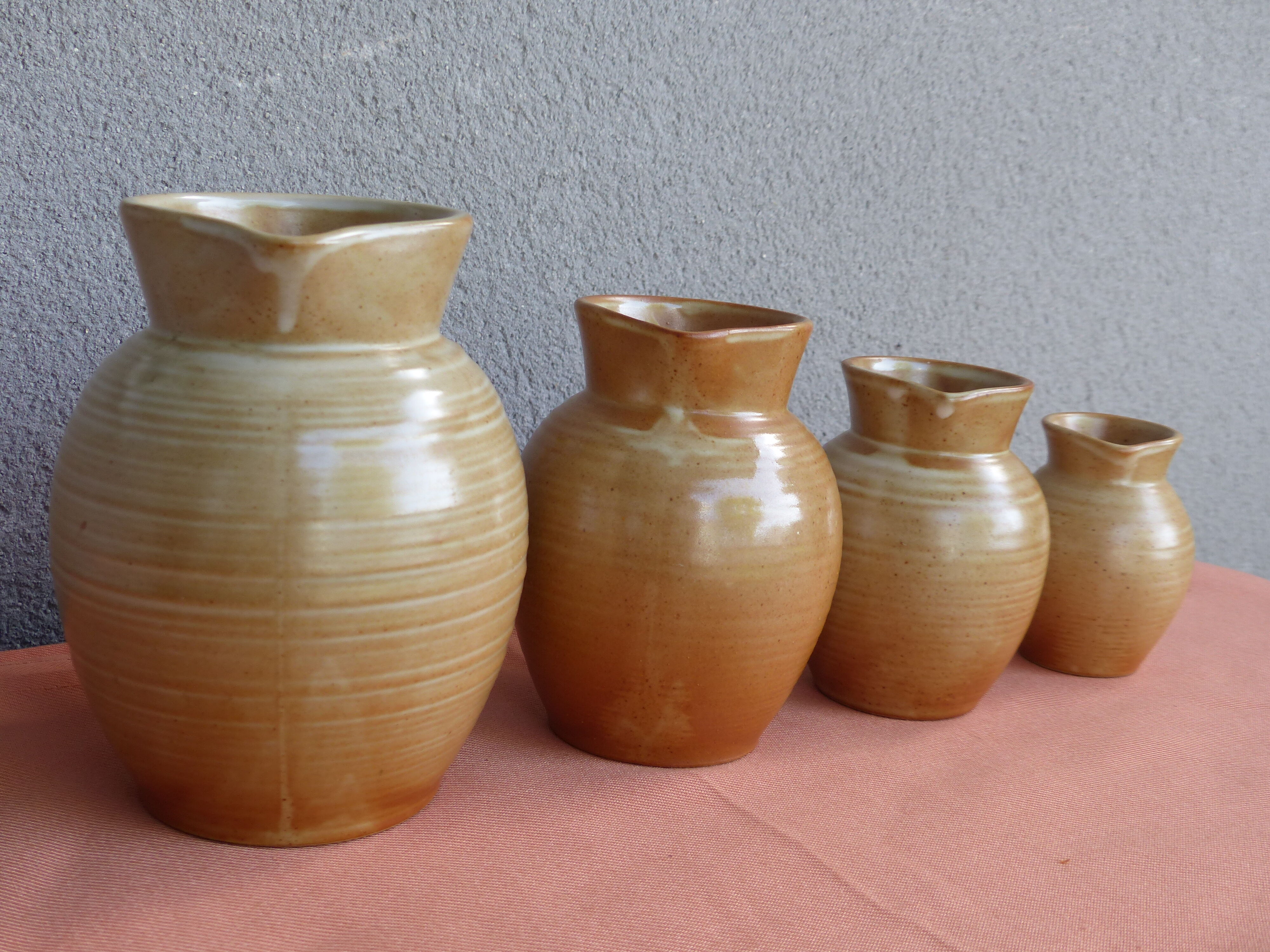 Set of 4 pitchers, CNP, Grès Village France.