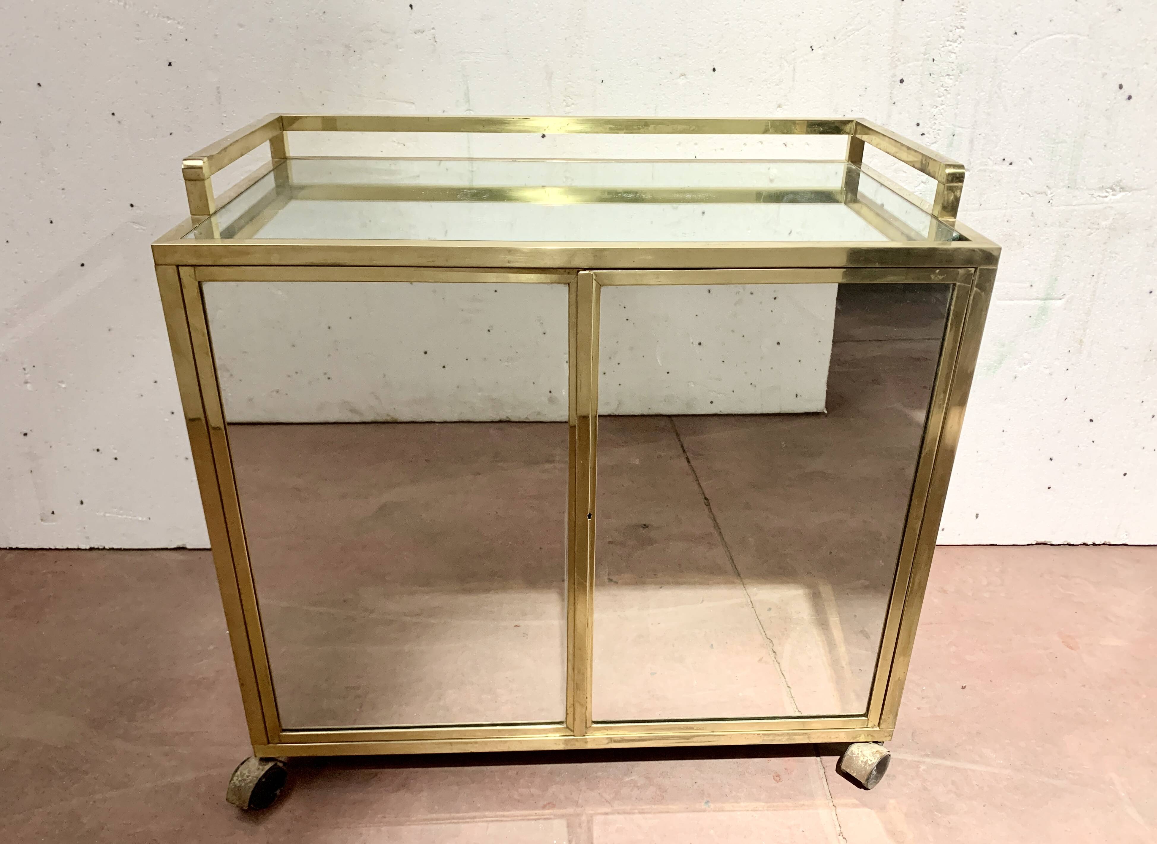 1970s brass bar with a mirrored front from the 20th century.