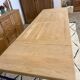 Solid oak extendable farmhouse table with 2 drawers.