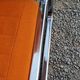 Pair of designer armchairs in orange fabrics and chrome tubes from the 70s