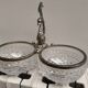 Crystal bowls joined by "swan neck" design.