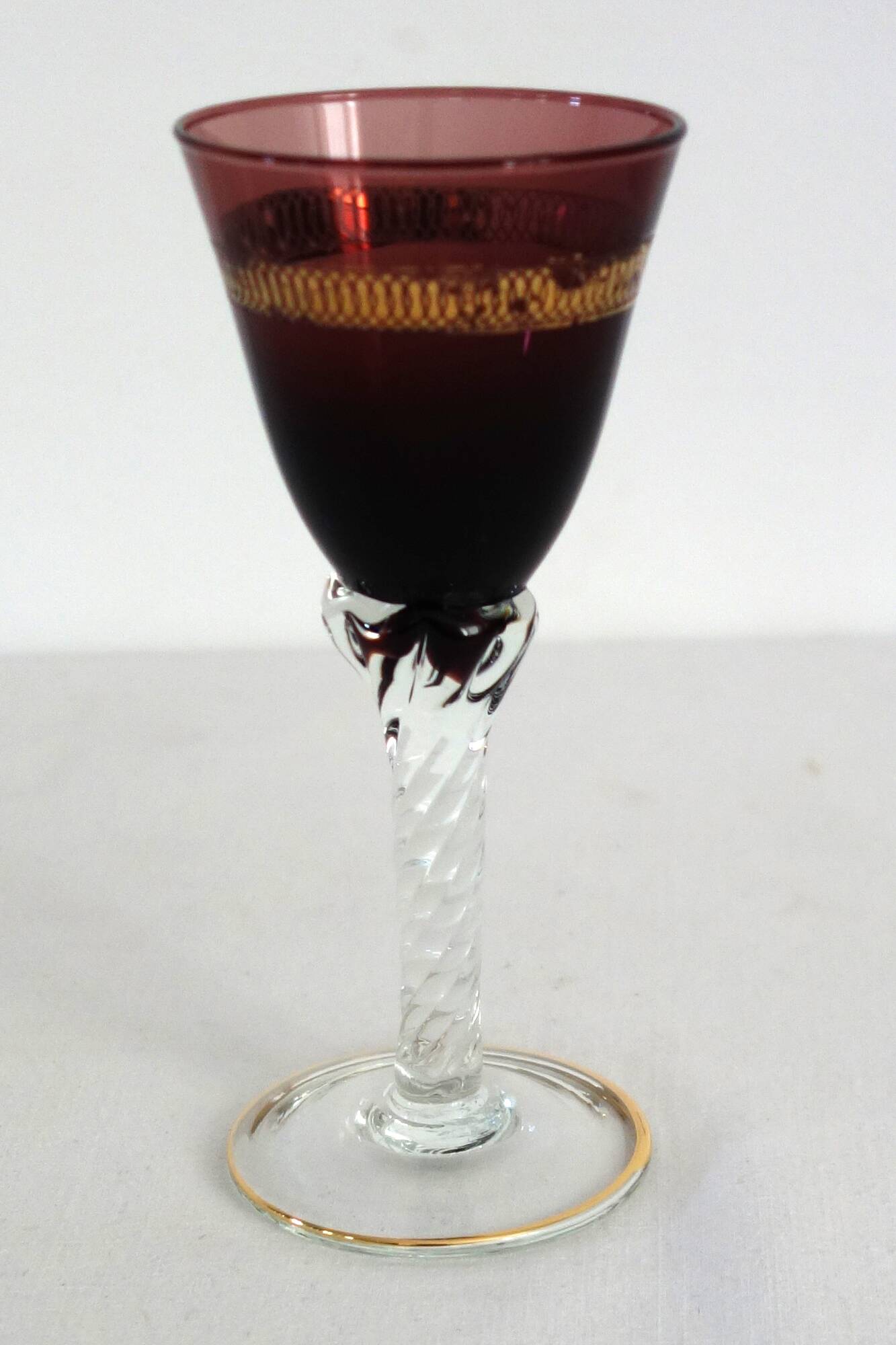 6 multicolored aperitif glasses with twisted legs