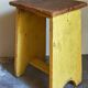 Art-populaire workshop stool in patinated painted wood