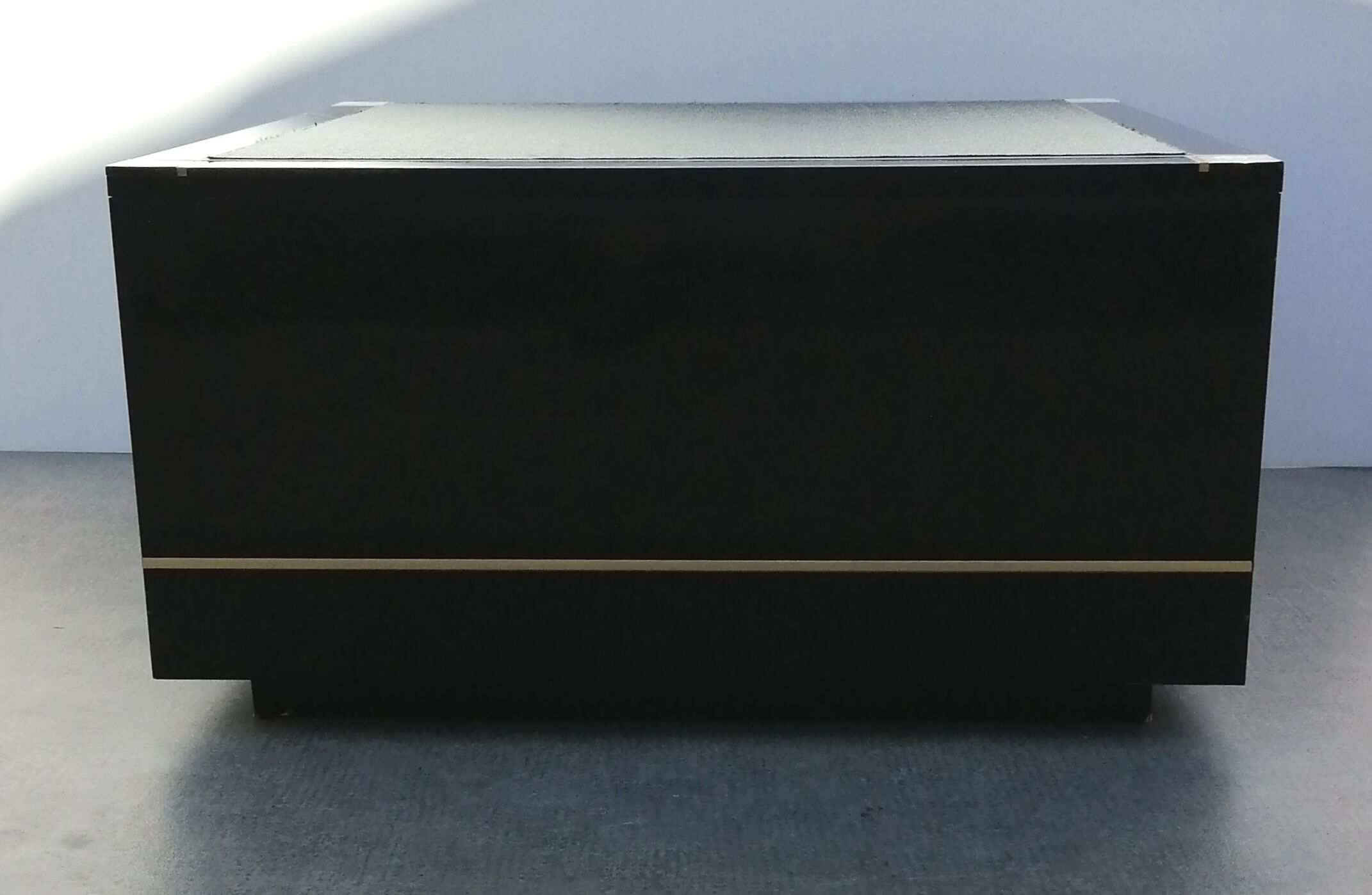 Designer coffee table in black lacquered wood and vintage brass