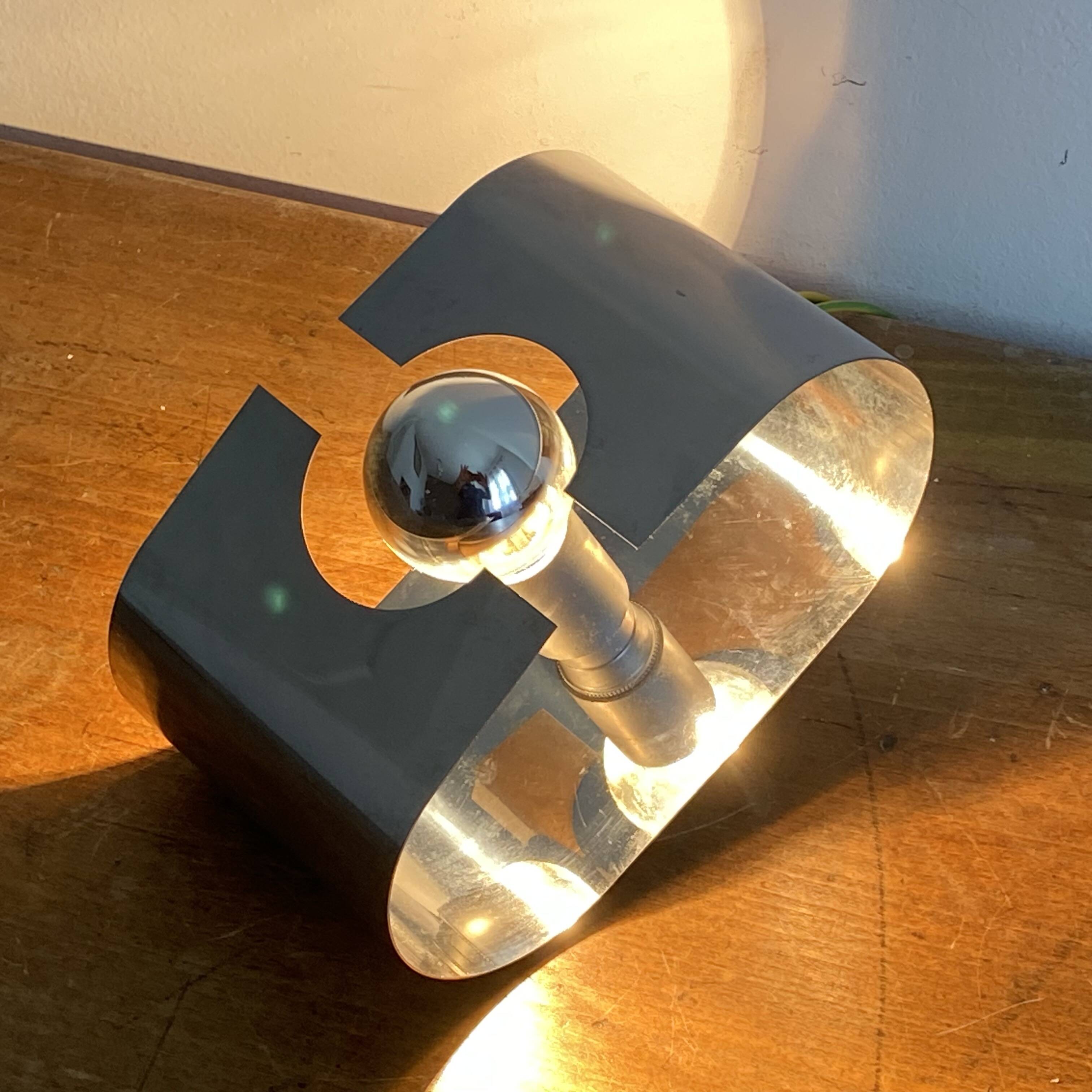 Space age wall light. 1970. Chrome steel.