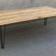 Wooden coffee table with pin legs