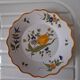 Glazed terracotta cap plate with yellow tulip