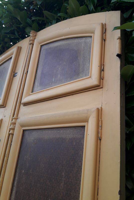 19th century double arched entrance door in oak with grilles and old glass