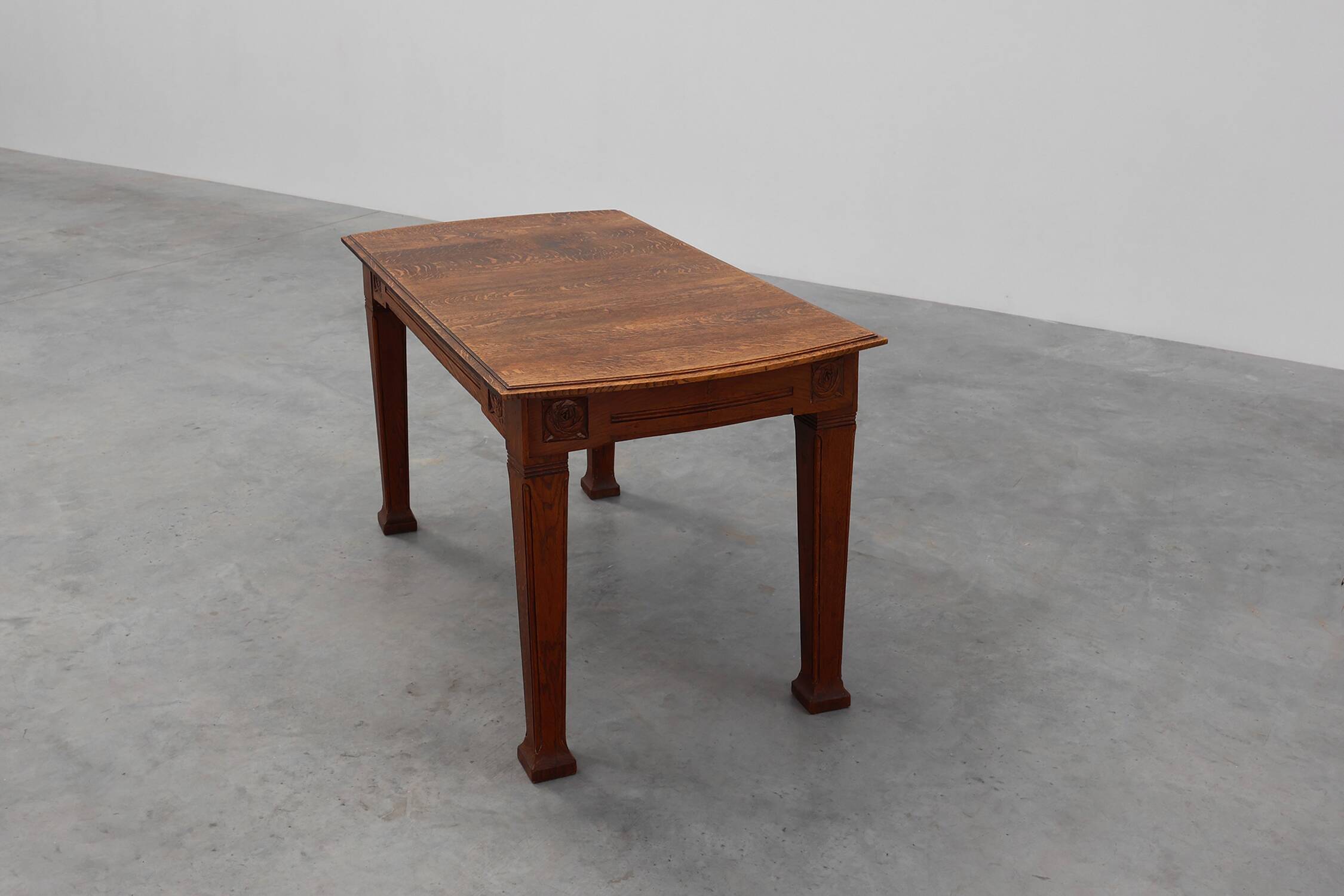 Oak Art Deco dining table with carved frieze, France 1920s