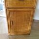 Storage column, wooden bookshelf and woven rattan.