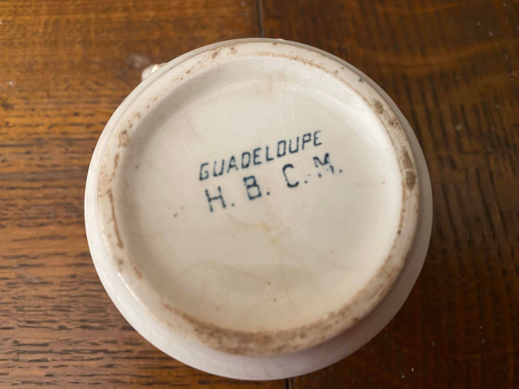 Cup and saucer old Iron earth stamped H.B.C.M Guadeloupe decoration flowers blue-green