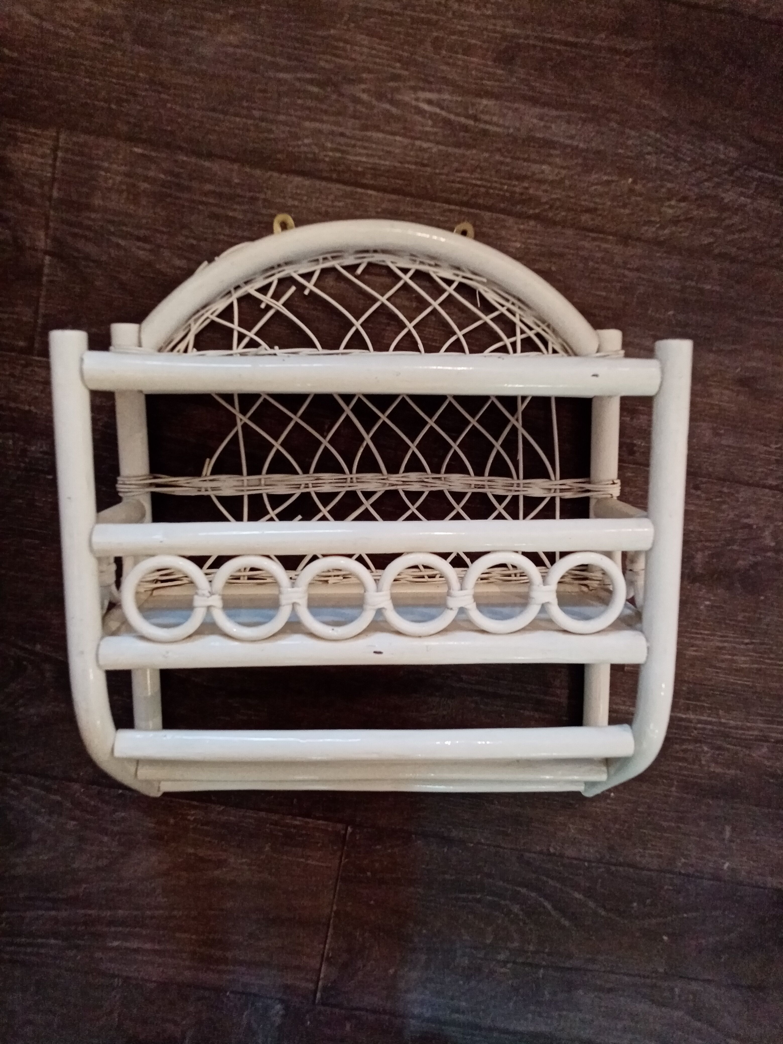 White rattan wall shelf