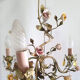 Painted metal chandelier and porcelain flowers