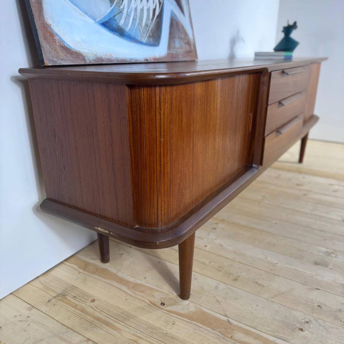 Vintage teak sideboard with rounded edges and sliding doors – mid-century Scandinavian design.