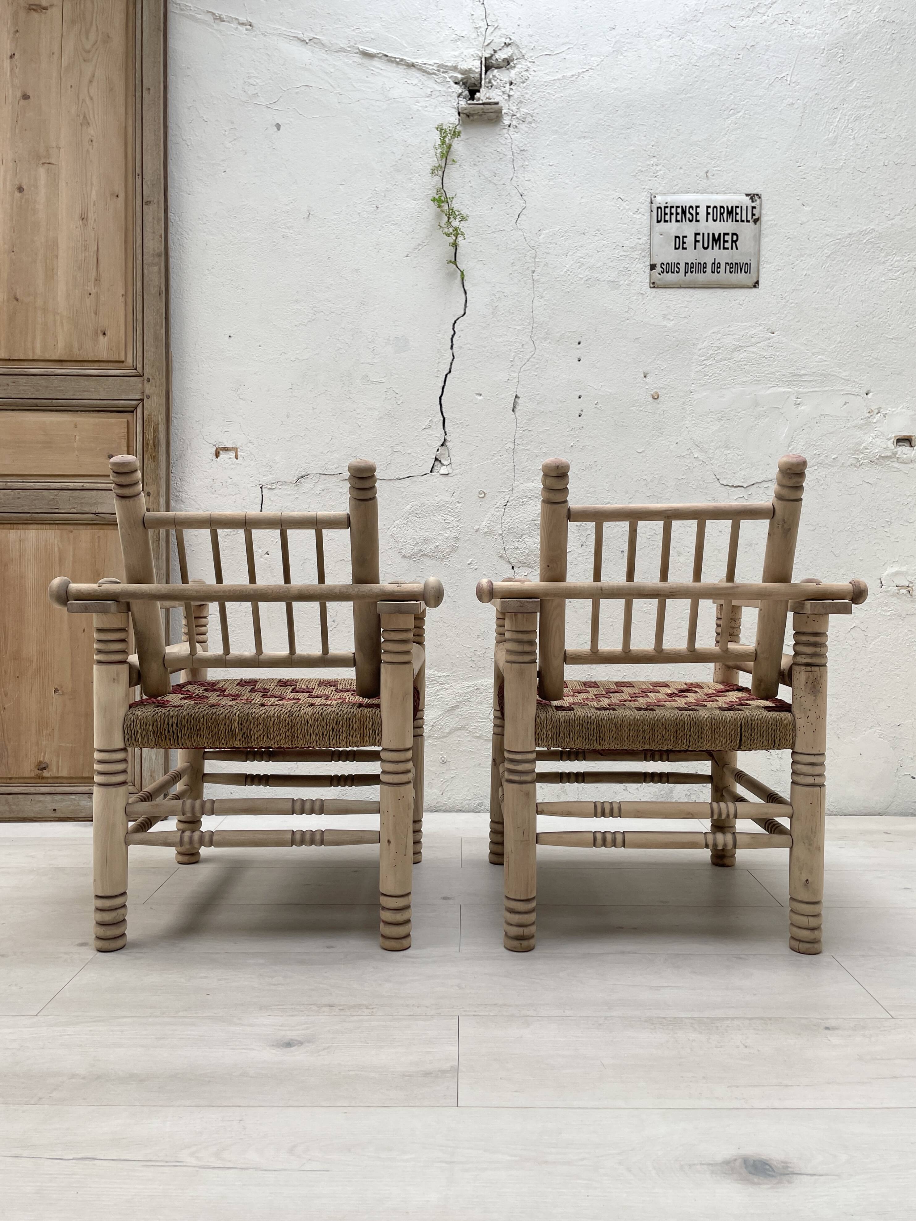 Pair of wooden armchairs and ropes