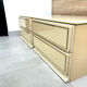 Pair of bedside tables with 2 drawers, glossy cream and gold, 1980.