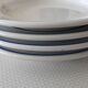 3 Pillivuyt white porcelain dinner plates with blue edging.