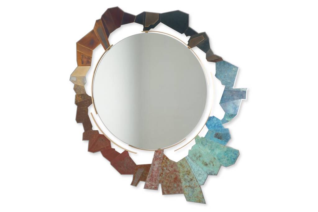 Contemporary mirror in oxidized bronze and brass with a deconstructed shape.