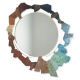 Contemporary mirror in oxidized bronze and brass with a deconstructed shape.