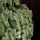 Green vase from Manises with leaf decoration.