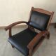 Teak armchair and black leather