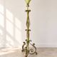 Antique green-painted iron floor lamp with a floral design.