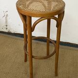 High stool in curved wood and cane seat