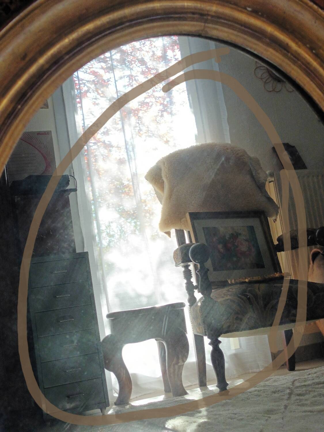 Antique oval gilded stucco mirror